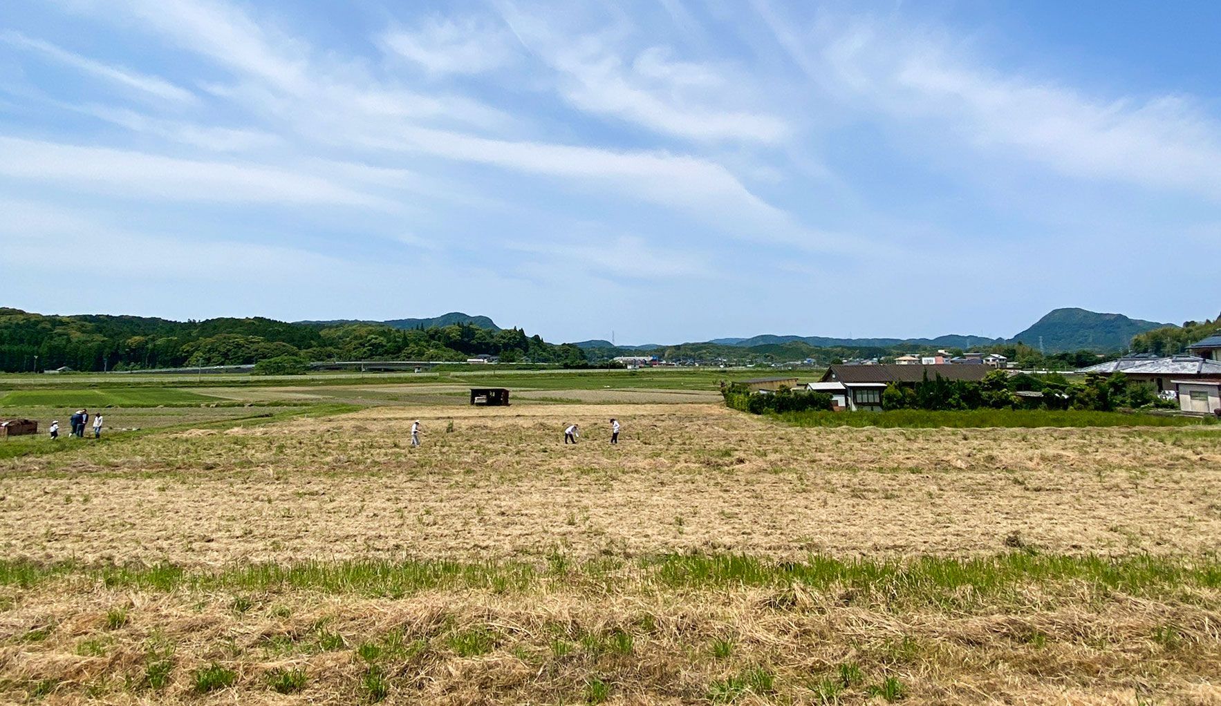 Fields after harvest, hills and blue sky